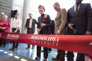 Vangie is pictured above ready to cut the ribbon and officially open the Hagfors Center for Science, Business, and Religion.